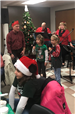 The band and kids singing carols