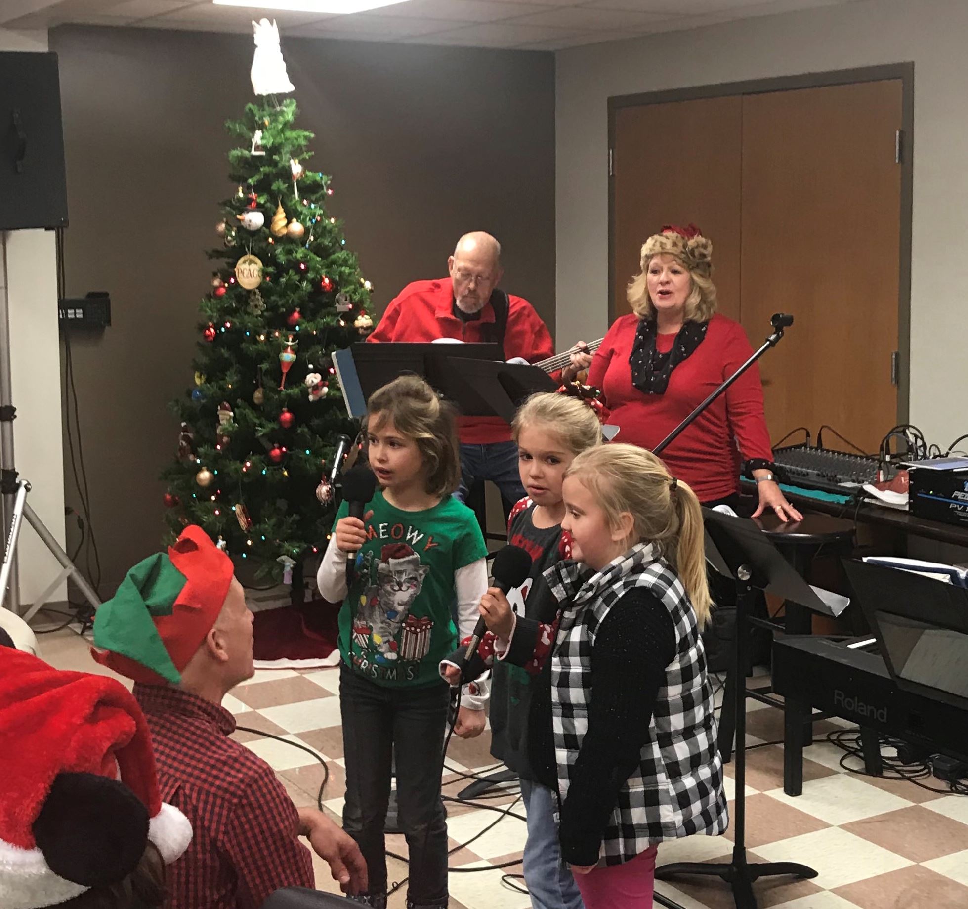 The band and kids singing carols